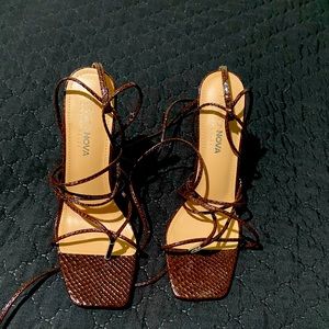 Brown faux snake skin tie up heels.